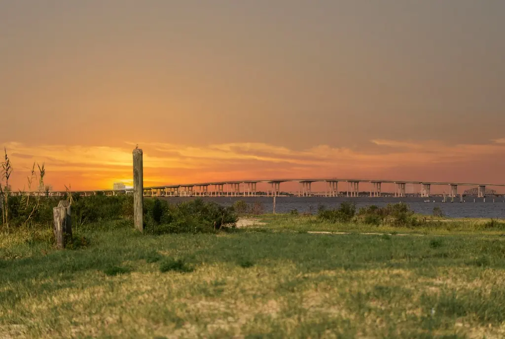 Biloxi Bay Bridge from a grassy shoreline in Ocean Springs, Mississippi